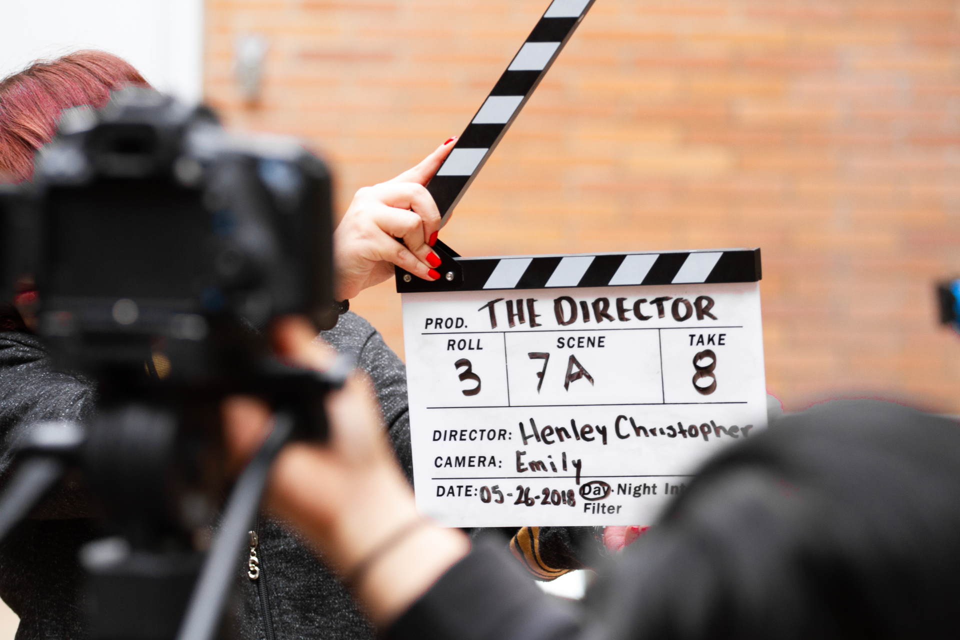 Film crew using a clapperboard on set, representing South Africa’s creative economy and the importance of local insurance for film and events.