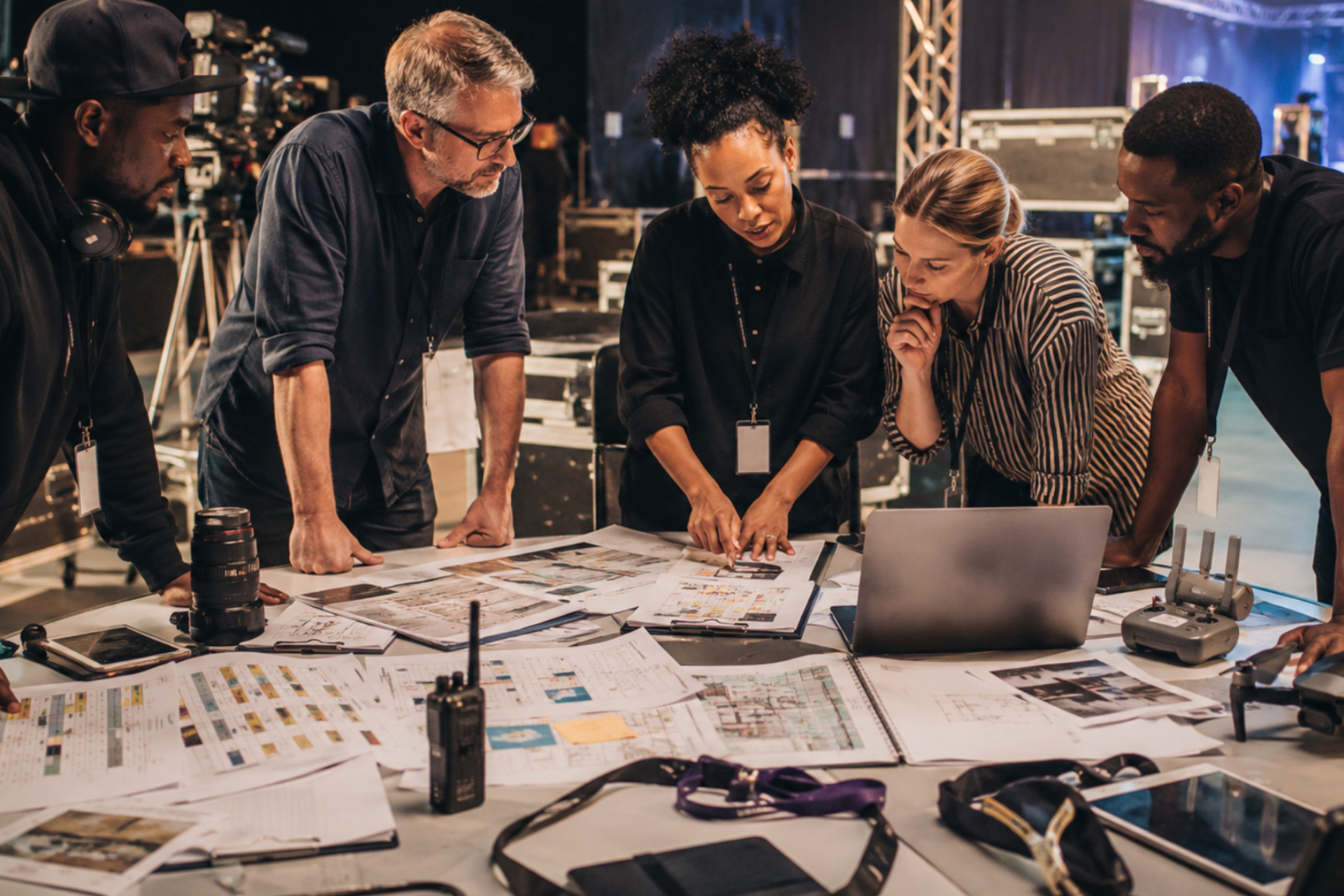 Film and events team reviewing production plans backstage